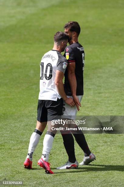 Tom Lawrence of Derby County clashes with Matt Miazga of Reading at full time of the Sky Bet Championship match between Derby County and Reading at...