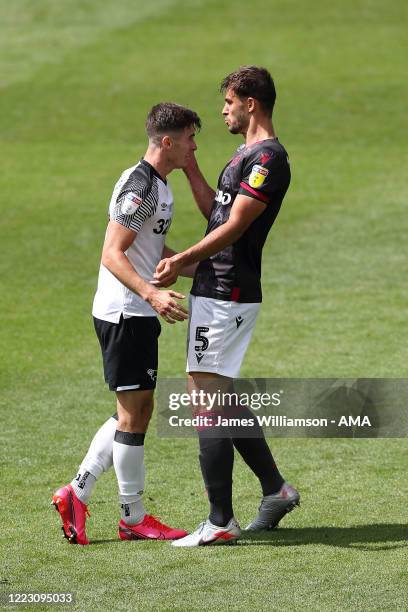 Tom Lawrence of Derby County clashes with Matt Miazga of Reading at full time of the Sky Bet Championship match between Derby County and Reading at...