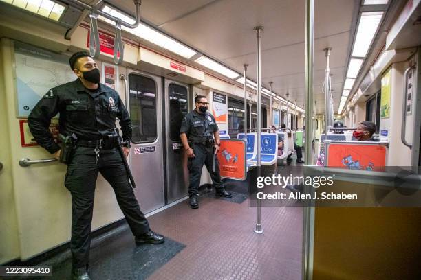 Officers E. Rosales, left, and D. Castro, patrol the Metro Red Line at the Hollywood/Highland Metro Station Thursday, June 25, 2020 in Hollywood, CA....