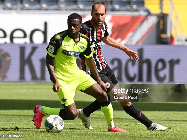 Jamilu Collins of SC Paderborn 07 and Bas Dost of Eintracht Frankfurt battle for the ball during the Bundesliga match between Eintracht Frankfurt and...