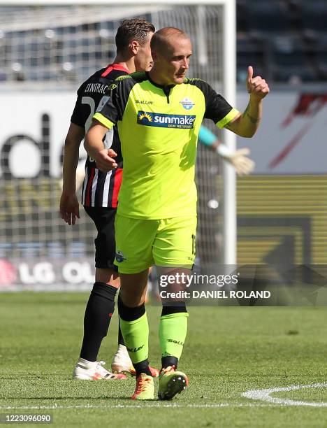 Paderborn's German forward Sven Michel celebrates scoring the 3-2 during the German first division Bundesliga football match Eintracht Frankfurt v SC...