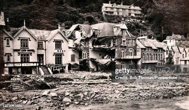 Vintage postcard featuring the aftermath of the flooding at Lynmouth in Devon, resulting in substantial property damage and the loss of 34 lives, on...