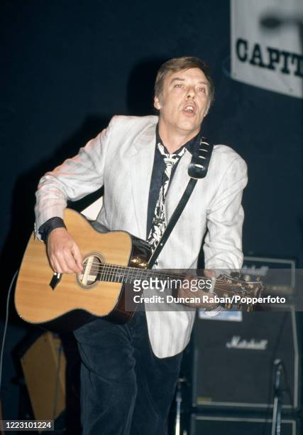 English singer songwriter Marty Wilde performing on stage, circa 1985.