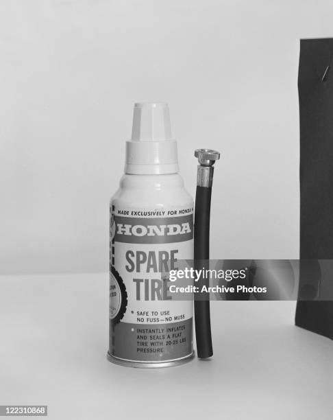 Spare tire spray bottle on white back ground, close-up