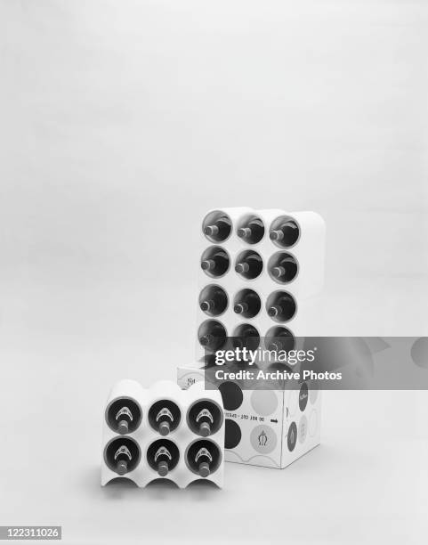 Wine bottles in rack on white background