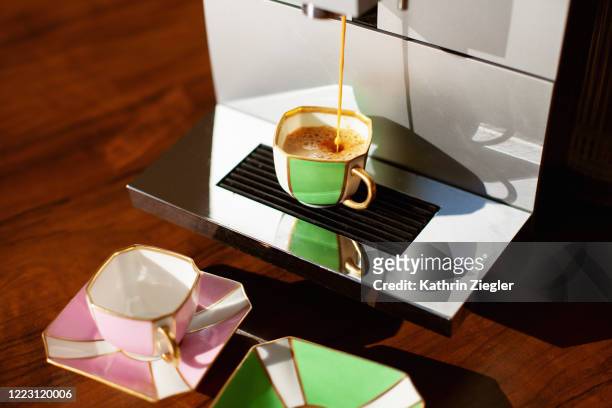 espresso pouring from coffee machine - coffee machine home stock pictures, royalty-free photos & images