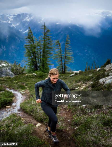 healthy woman mountain trail running - lake chelan stock pictures, royalty-free photos & images