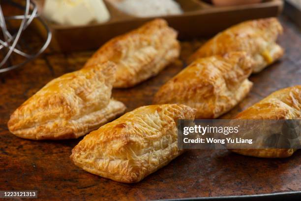 puff pastry  for dessert on a wooden table - strudel stock pictures, royalty-free photos & images