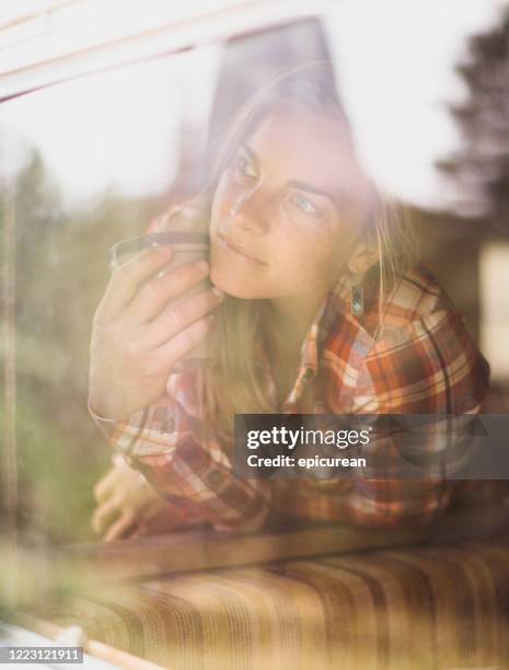 Staring Longingly 34 Looking Longingly Out Window Stock Photos, High-Res Pictures, and ...