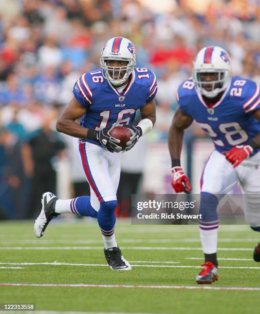 Brad Smith of the Buffalo Bills runs with blocking from C.J. Spiller of the Buffalo Bills at Ralph Wilson Stadium on August 27, 2011 in Orchard Park,...