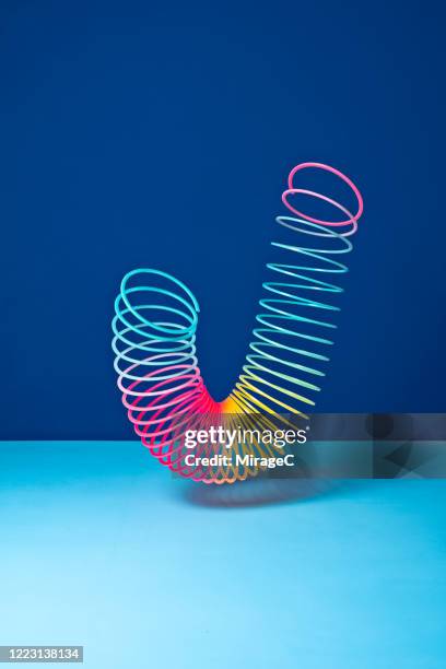 stretched coil spring toy - metal coil stock pictures, royalty-free photos & images