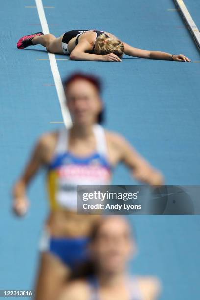 Nikki Hamblin of New Zealand falls during the women's 1500 metres heats during day two of the 13th IAAF World Athletics Championships at the Daegu...