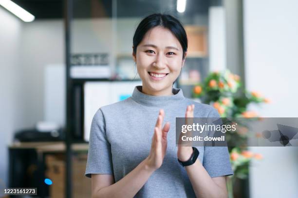 portrait of young asian female in office - japanese greeting stock pictures, royalty-free photos & images