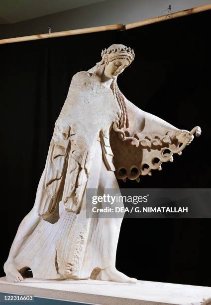 Greek civilization, 6th century b.C. Marble statue of Athena from the east pediment of the Temple of Athena Polis depicting a Gigantomachy, 520 b.C.