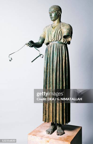 Greek civilization, 5th century b.C. Bronze statue of the Charioteer of Delphi, also known as Heniokhos, circa 475 b.C., height 180 cm. From Delphi,...