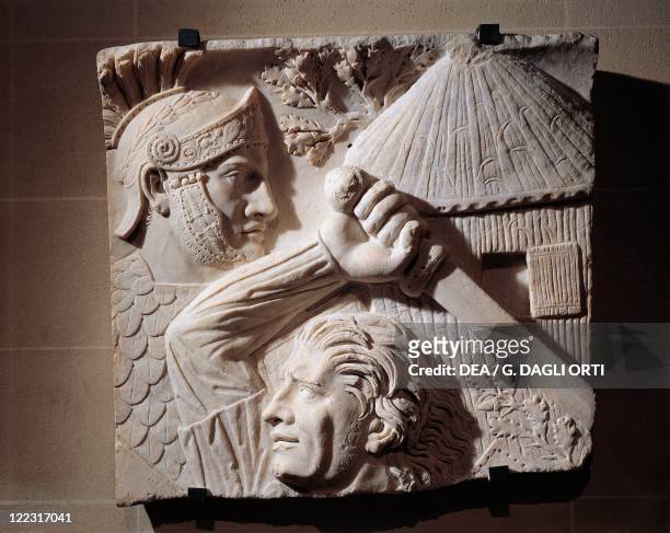 Roman civilization, 2nd century A.D. Marble relief representing a Barbarian fighting against a Roman. From Rome, Trajan's Forum.