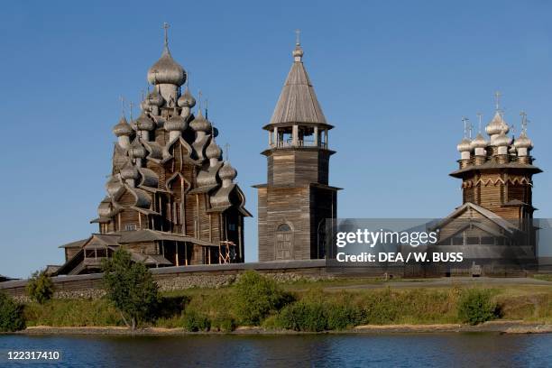 Russia - Karelia - Lake Onega - Kizhi Island - Kizhi Pogost . Wooden Church of the Transfiguration , octagonal bell tower and Intercession Church .