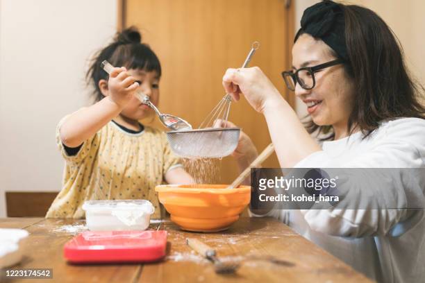 family making cookies at home - sifting stock pictures, royalty-free photos & images