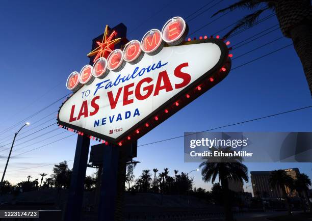 Red lights flicker around the Welcome to Fabulous Las Vegas sign as part of a "red takeover" coinciding with the 37th National Travel and Tourism...