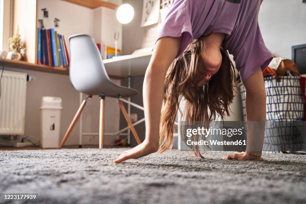 girl doing handstand at home - girl upside down stock pictures, royalty-free photos & images