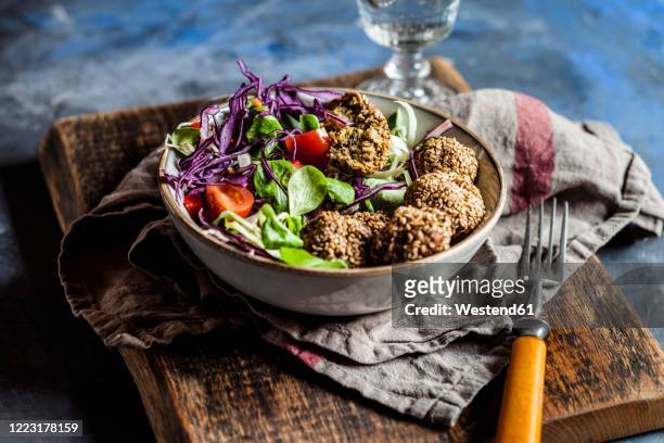 bowl ofready-to-eatsalad with spinachfalafel - falafel stock pictures, royalty-free photos & images
