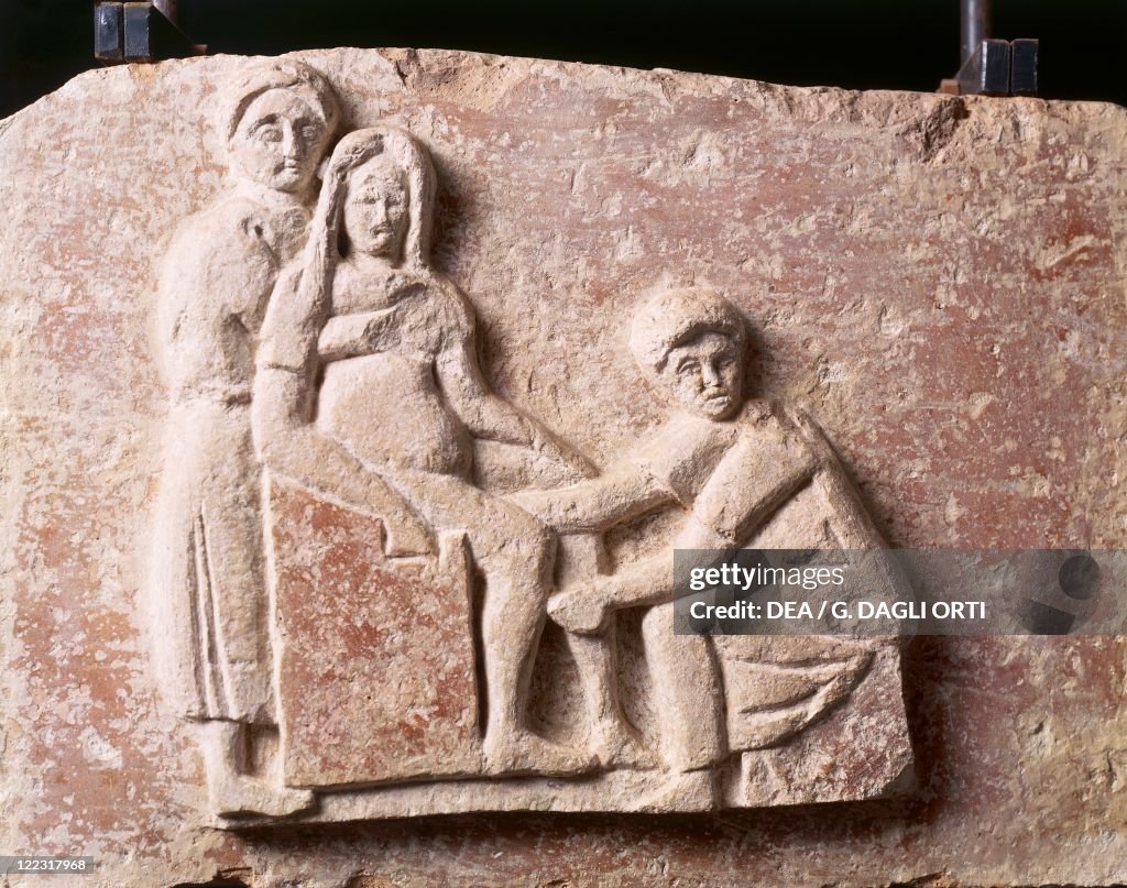 Relief depicting childbirth scene, from tomb of Scribonia Attica at necropolis of Isola Sacra, Rome, Italy