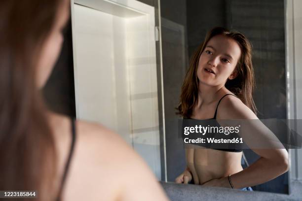 mirror image of girl watching herself in bathroom - kids in undies stock pictures, royalty-free photos & images