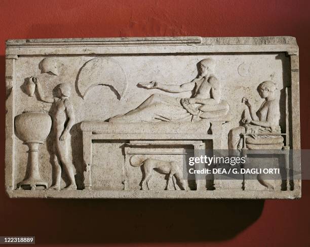 Greek civilization, 6th century b.C. Marble relief depicting a banquet scene. From Thasos, Greece.