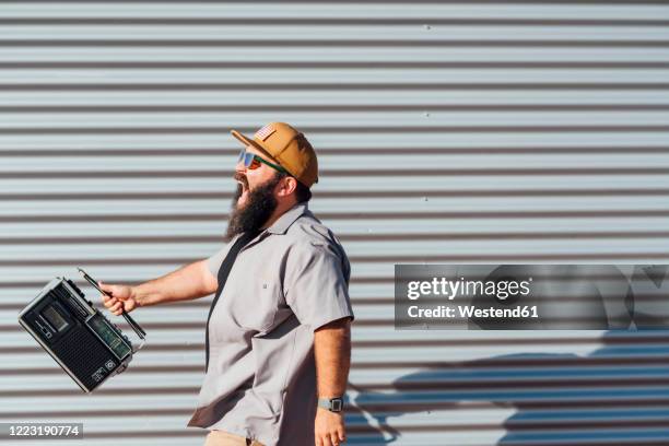 bearded man with portable radio - listening to radio stock pictures, royalty-free photos & images