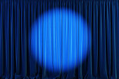Blue curtains with spotlight or flash.