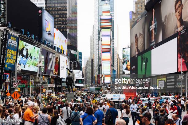 crowds of people on times square, manhattan, new york city, usa - times square stock pictures, royalty-free photos & images
