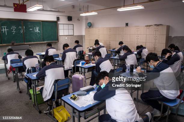 Senior students study in a classroom No. 6 Middle School on May 6, 2020 in Wuhan, Hubei Province, China. About 57,800 students in their final year...
