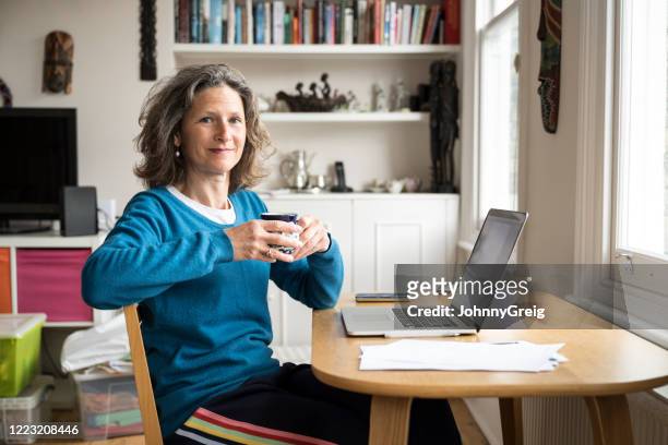 portrait of mature businesswoman working  at home - 50 54 years stock pictures, royalty-free photos & images