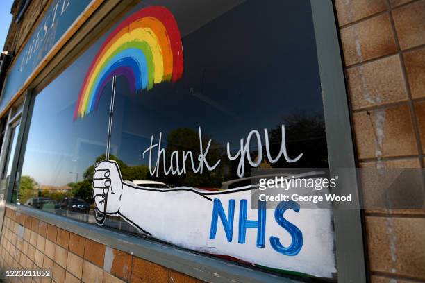 General view of a painting of a rainbow in a Cafe window saying thank you to the NHS and Key Workers on May 06, 2020 in Bradford, England. The UK is...