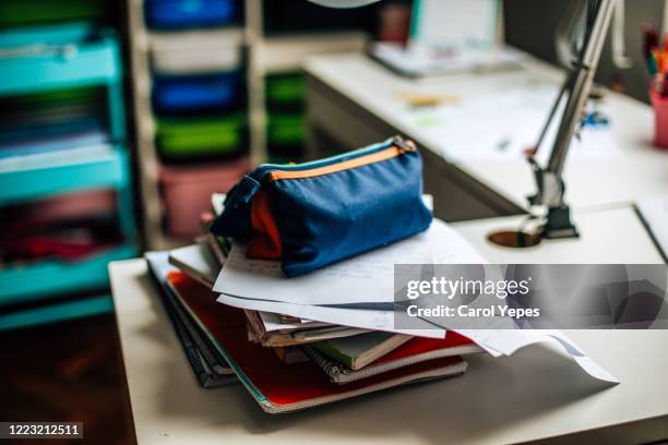 student supplies on desk at home - etui stockfoto's en -beelden