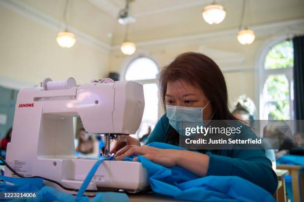 Volunteers manufacture surgical gowns, made from operating theatre drapes, for The Royal Free Hospital at WAC Arts in Belsize Park on May 06, 2020 in...