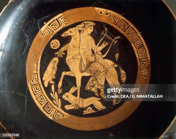 Italic civilization, Falisci, 4th century b.C. Red-figure pottery. Kylix with Apollo on the mule, from Falerii Veteres .