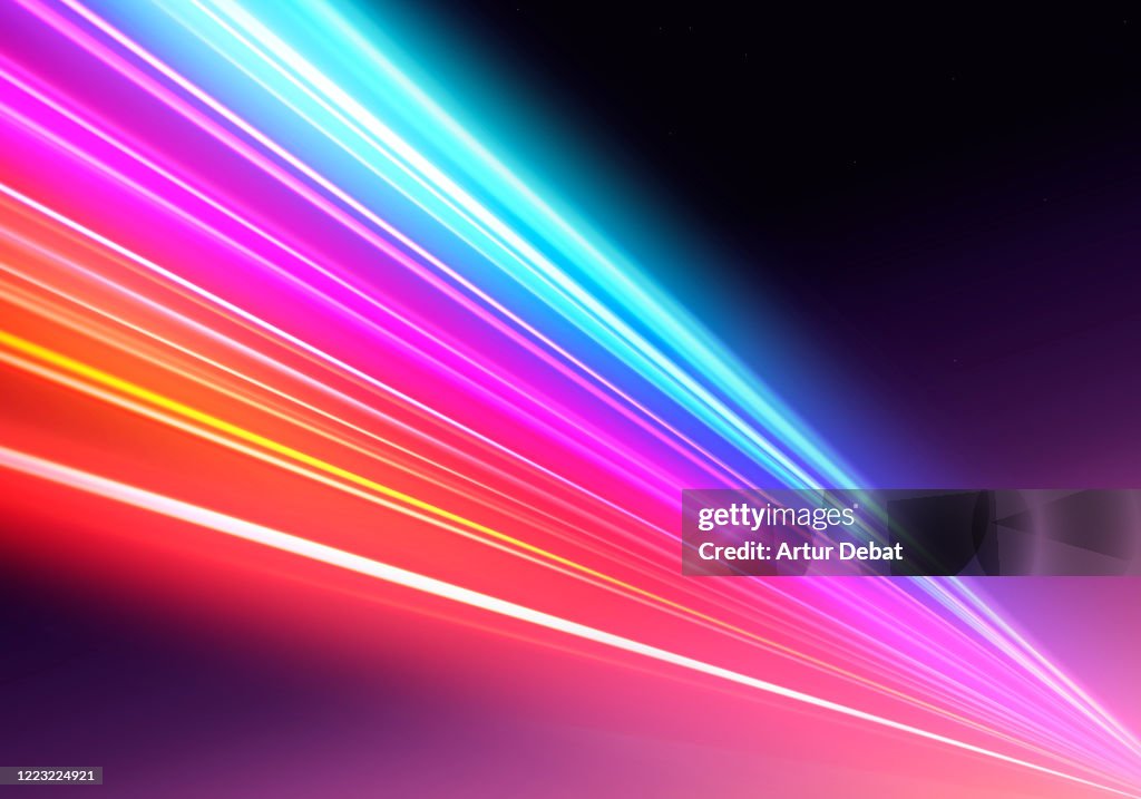 Abstract picture of colorful light trails crossing twilight sky with fast motion.