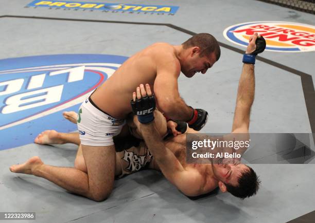 Mauricio "Shogun" Rua knocks out Forrest Griffin with punches on the ground in a light heavyweight bout at UFC 134 at HSBC Arena on August 27, 2011...