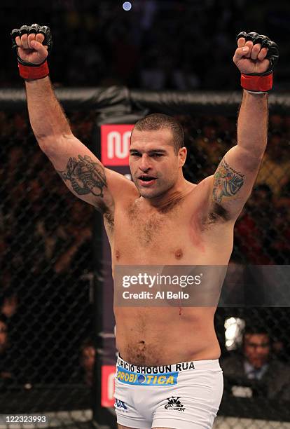 Mauricio "Shogun" Rua celebrates after knocking out Forrest Griffin in a light heavyweight bout at UFC 134 at HSBC Arena on August 27, 2011 in Rio de...