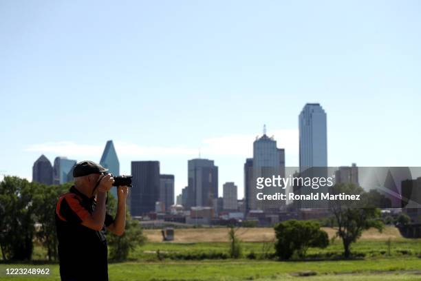 Photographer takes pictures before the U.S. Navy Blue Angels flyover downtown Dallas to honor healthcare, frontline and essential workers on May 06,...