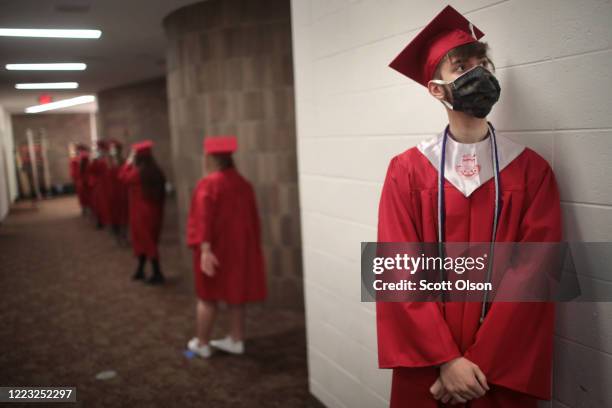 Students wait to walk across the stage to receive their diplomas during a graduation ceremony at Bradley-Bourbonnais Community High School on May 06,...