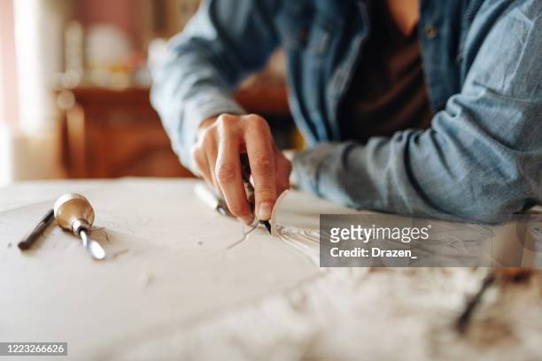 close up of unrecognizable woman doing linocut technique with copy space - lino stock pictures, royalty-free photos & images