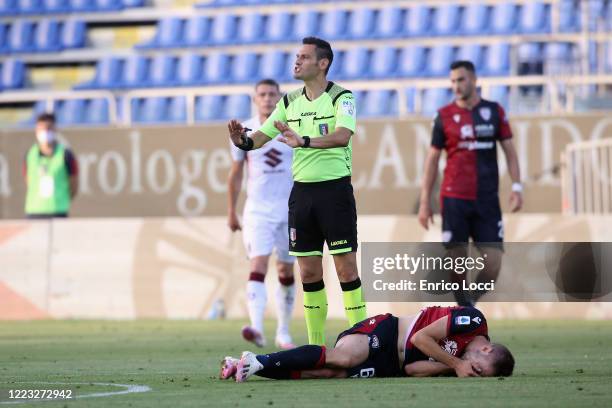 Marko Rog of Cagliari injured during the Serie A match between Cagliari Calcio and Torino FC at Sardegna Arena on June 27, 2020 in Cagliari, Italy.