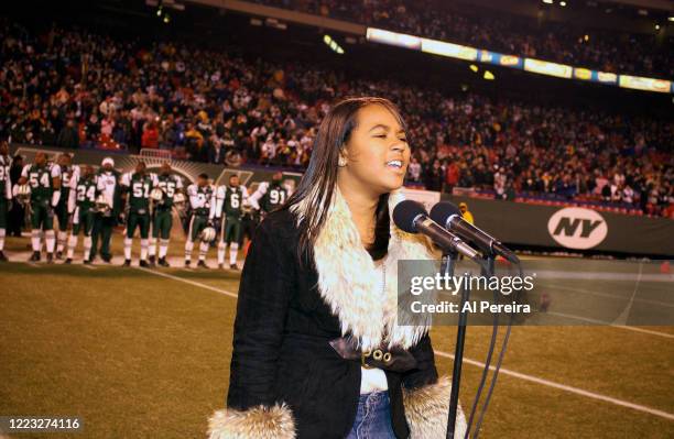 Shia performs the National Anthem when she attends the New York Jets vs New England Patriots game at The Meadowlands on December 20, 2003 in East...