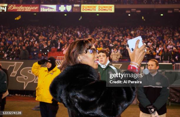 Ashanti and Shia, 's mother takes a video when she attends the New York Jets vs New England Patriots game at The Meadowlands on December 20, 2003 in...