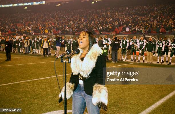 Shia performs the National Anthem when she attends the New York Jets vs New England Patriots game at The Meadowlands on December 20, 2003 in East...