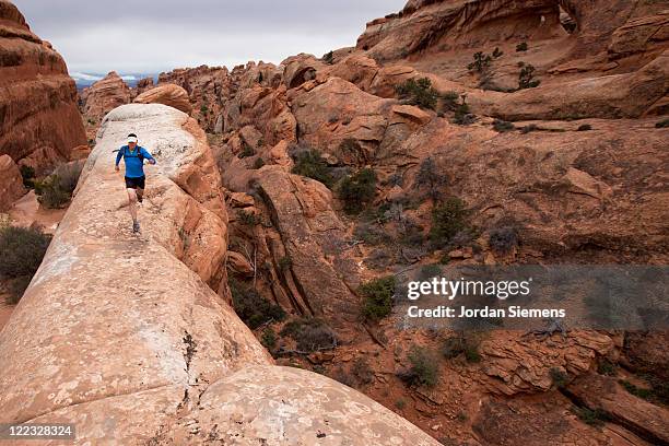 Guy Running Down Red Rocks Backwards Canyon Run Photos and Premium High Res Pictures - Getty Images