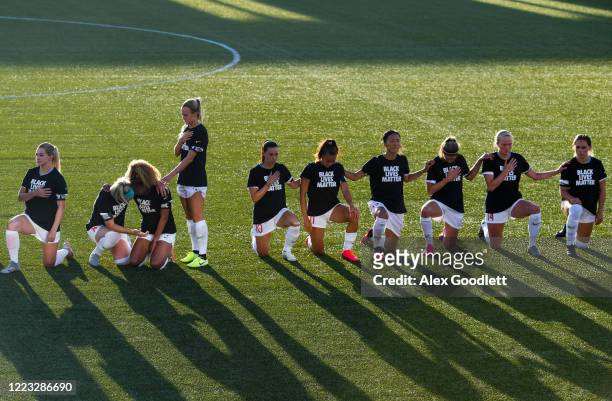 Members of Chicago Red Stars take a knee during national anthem before a game against the Washington Spirit in the first round of the NWSL Challenge...