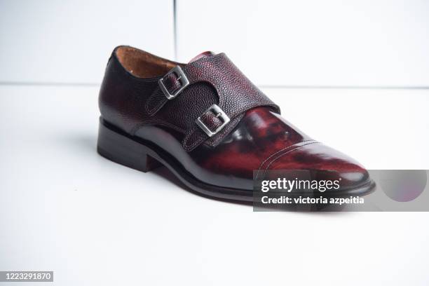 red leather shoe on white background - buckle fotografías e imágenes de stock